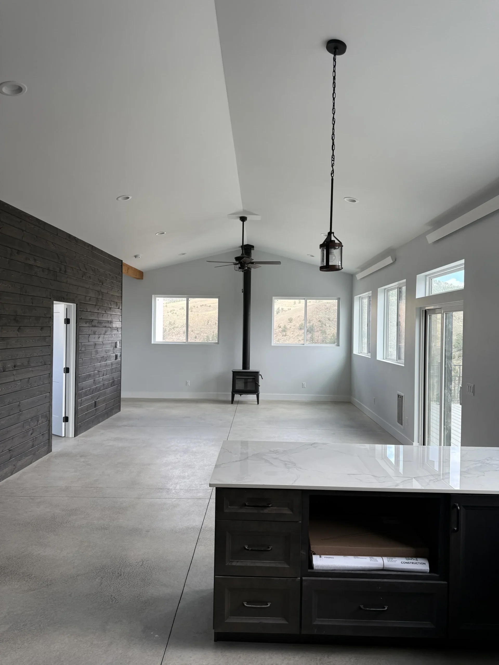 Interior view of the grand living space facing the wood burning stove - Mountain View Custom Home Builders S&T Construction Company Buena Vista Colorado