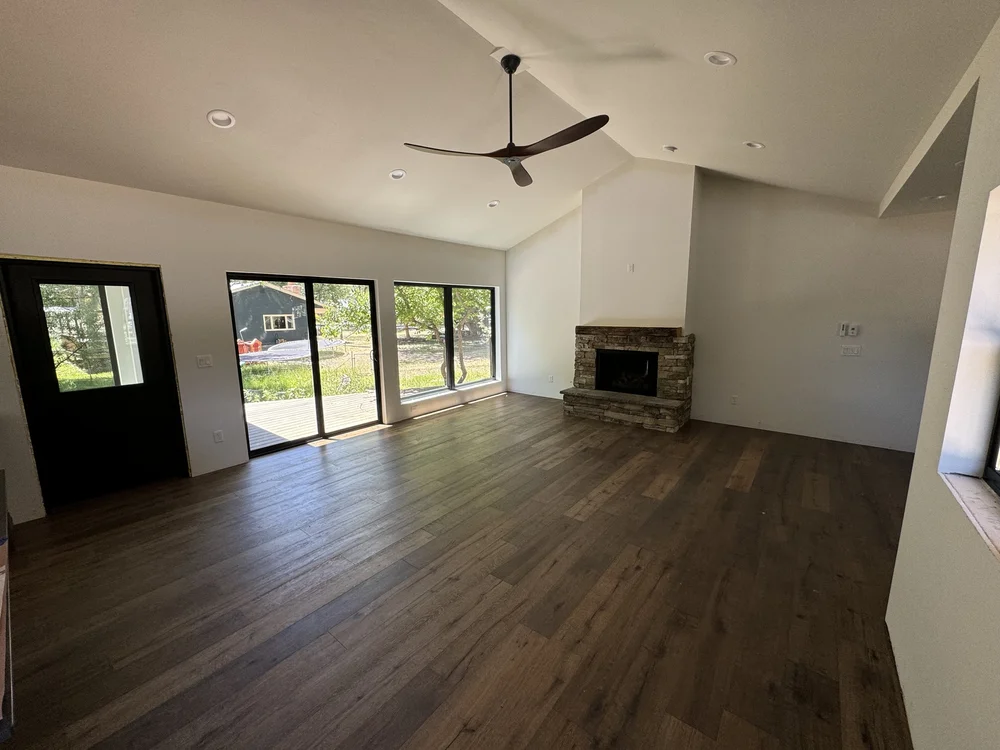 Fireplace view from inside the grand room and french doors leading outside - Home Addition + Garage - Home Renovation Company Contractors - S&T Construction Company Buena Vista Colorado