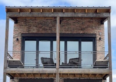 View of second story patio with panoramic windows - Mountain View Custom Home Builders S&T Construction Company Buena Vista Colorado