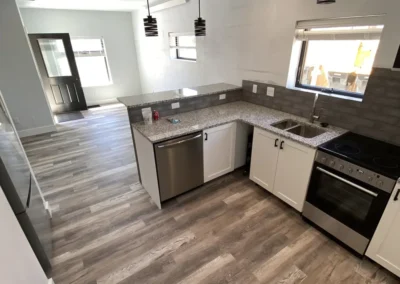 Condo kitchen open living space facing the entrance - Mountain View Custom Home Builders S&T Construction Company Buena Vista Colorado