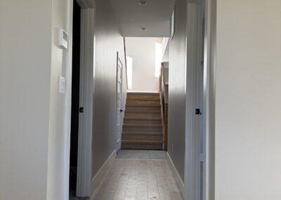 Bedroom hallways leading to staircase in Custom Home with Lockoff ADU in Buena Vista by S&T Construction 65ED171F 4480 4376 B175 94A13FC5F432 1 102 o
