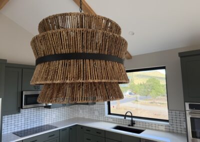 Custom kitchen chandelier wood design in Custom Home with Lockoff ADU in Buena Vista by S&T Construction 8E374B9B 68F5 4254 8C4F 66521A6C8A5A 1 105 c