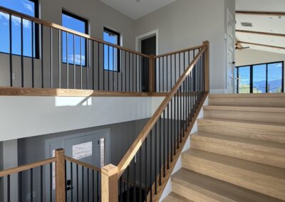 Grand looking beautiful indoor staircase with lofted halls in Custom Home with Lockoff ADU in Buena Vista by S&T Construction 08BD4E1E B1E3 4CDA 9766 33CA0693FCF0 1 102 o