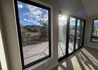 Walls of windows in grand room overlooking back patio Custom Home with Lockoff ADU in Buena Vista by S&T Construction 3EDDBD37 90B7 4311 ACD2 9403BCD3D5D4 1 102 o